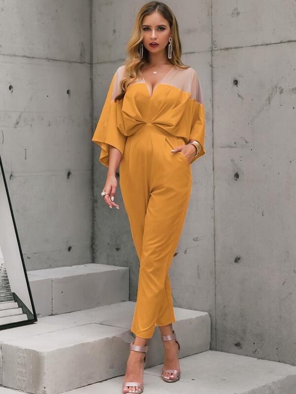 جمبسوت بأكمام واسعة وبصدر شبكي شفاف ولون موحد | شي ان